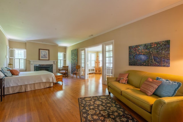 1286 W Stephenson St, Freeport, IL 61032 - bedroom featuring light wood-style floors, crown molding, and a fireplace