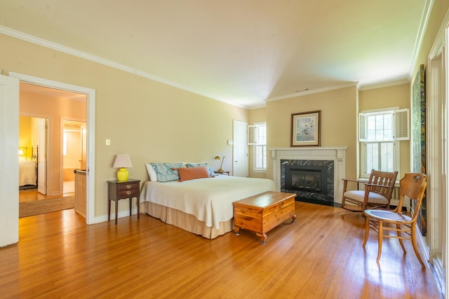 1286 W Stephenson St, Freeport, IL 61032 - bedroom featuring light wood finished floors, a high end fireplace, and crown molding