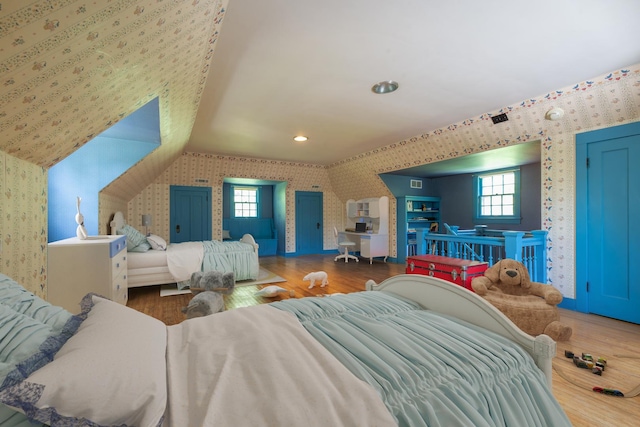1286 W Stephenson St, Freeport, IL 61032 - bedroom with wallpapered walls, wood finished floors, multiple windows, and recessed lighting