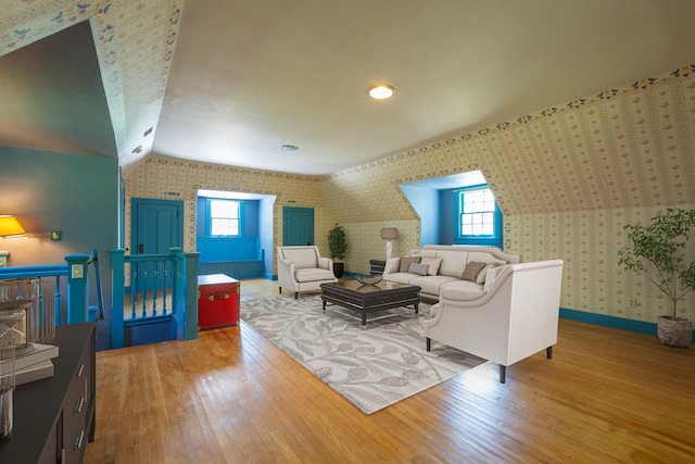 1286 W Stephenson St, Freeport, IL 61032 - living area with wallpapered walls, wood finished floors, plenty of natural light, and vaulted ceiling