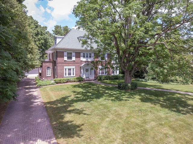 1286 W Stephenson St, Freeport, IL 61032 - view of front facade featuring brick siding and a front lawn