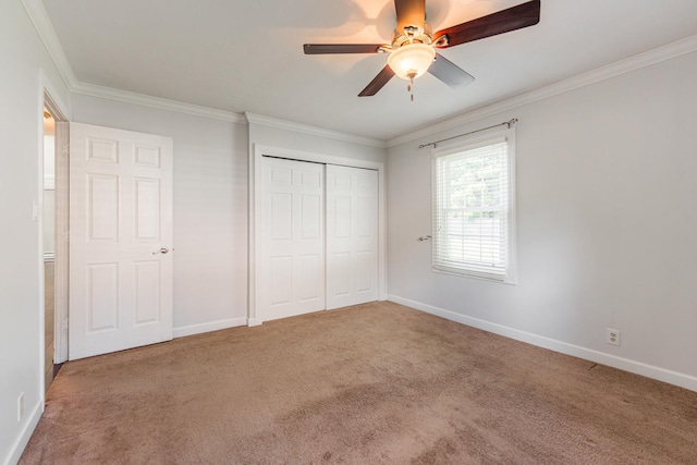 1614 E Dresser Rd, Dekalb, IL 60115 - unfurnished bedroom featuring ornamental molding, carpet flooring, a closet, and a ceiling fan