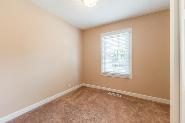 1614 E Dresser Rd, Dekalb, IL 60115 - carpeted empty room featuring baseboards