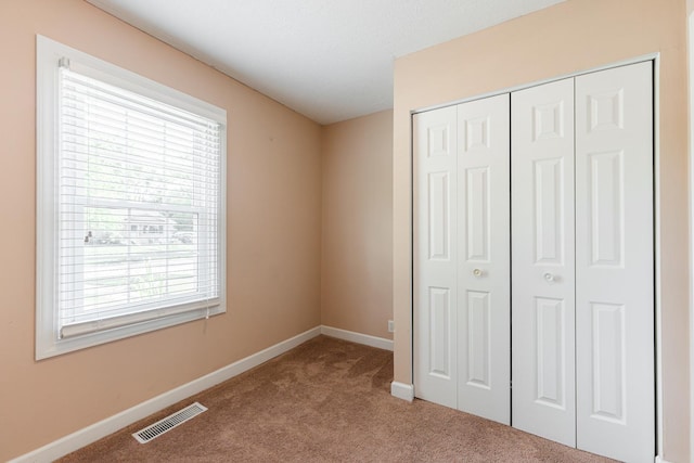 1614 E Dresser Rd, Dekalb, IL 60115 - unfurnished bedroom featuring carpet and a closet