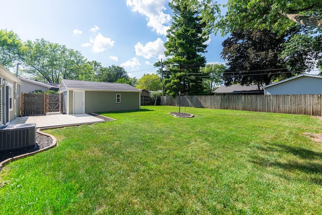 1614 E Dresser Rd, Dekalb, IL 60115 - fenced backyard featuring a patio area and an outbuilding