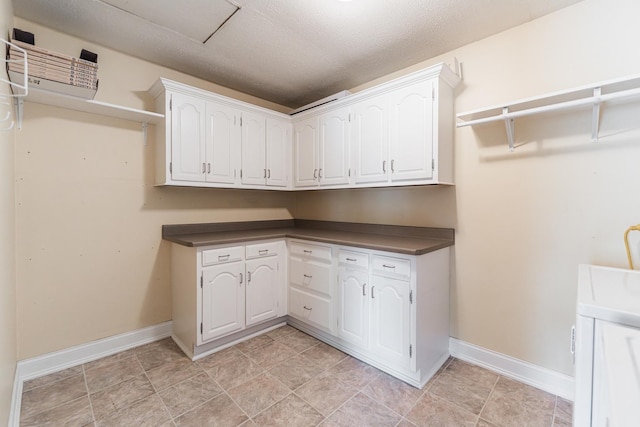 1614 E Dresser Rd, Dekalb, IL 60115 - washroom with baseboards and a textured ceiling