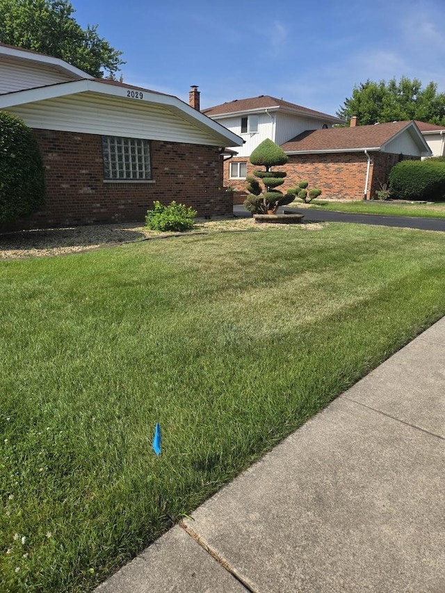 2029 171st Pl, South Holland, IL 60473 - view of front of property featuring brick siding and a front yard