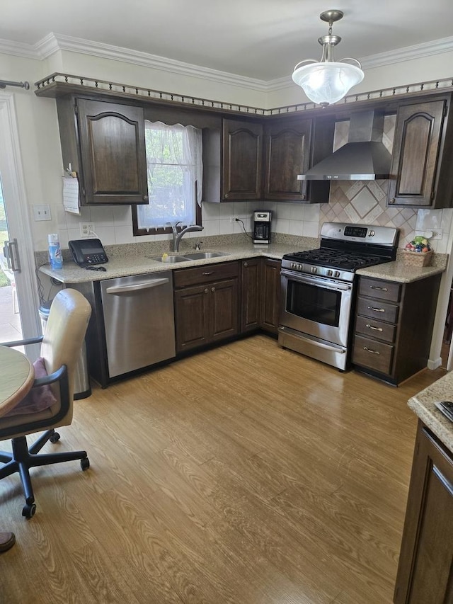 2029 171st Pl, South Holland, IL 60473 - kitchen with appliances with stainless steel finishes, wall chimney range hood, dark brown cabinetry, and ornamental molding