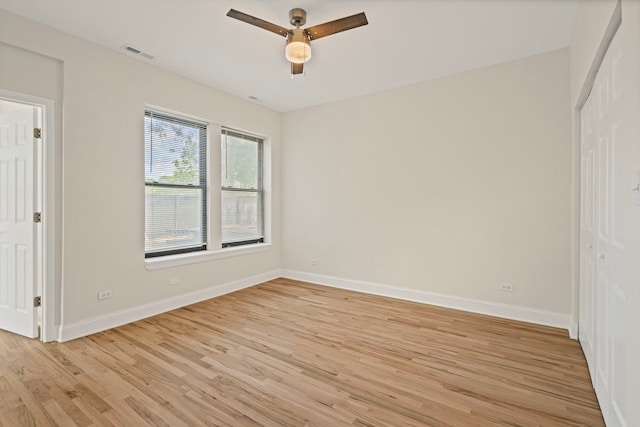 4557 S Michigan Ave Unit 1, Chicago, IL 60615 - unfurnished bedroom featuring light wood-style floors, a closet, and a ceiling fan