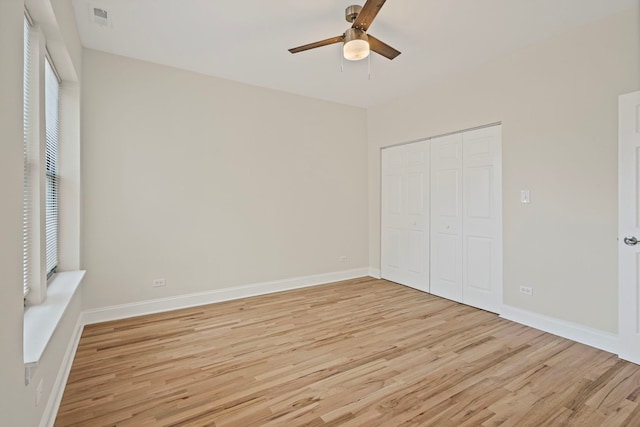 4557 S Michigan Ave Unit 1, Chicago, IL 60615 - unfurnished bedroom featuring light wood-type flooring, a closet, and ceiling fan