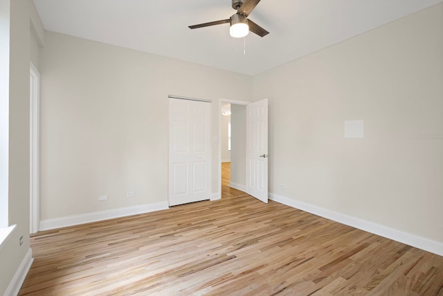 4557 S Michigan Ave Unit 1, Chicago, IL 60615 - unfurnished bedroom with light wood finished floors, a ceiling fan, and a closet