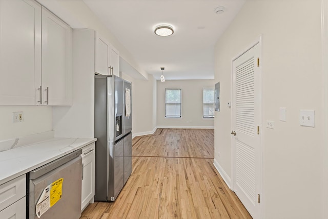 4557 S Michigan Ave Unit 1, Chicago, IL 60615 - kitchen featuring stainless steel appliances, white cabinetry, and light wood-style flooring