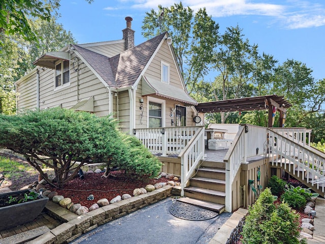 385 E Irving Park Rd, Streamwood, IL 60107 - view of front of property with stairway, a shingled roof, a wooden deck, and a pergola