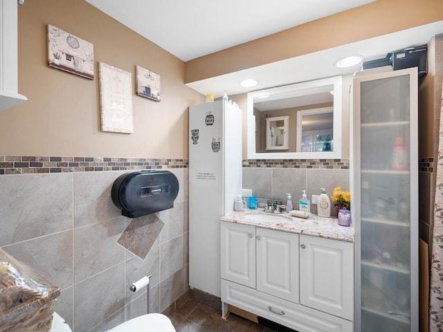 385 E Irving Park Rd, Streamwood, IL 60107 - bathroom featuring tile walls, vanity, and tile patterned floors