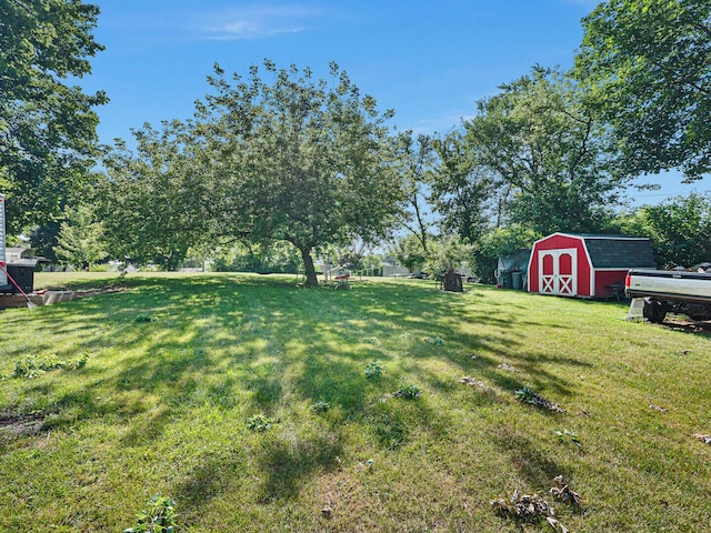 385 E Irving Park Rd, Streamwood, IL 60107 - view of grassy yard with a storage shed