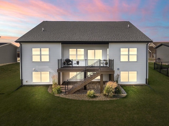 2621 Shale Rd, Normal, IL 61761 - back of house at dusk featuring stairway, roof with shingles, and a deck