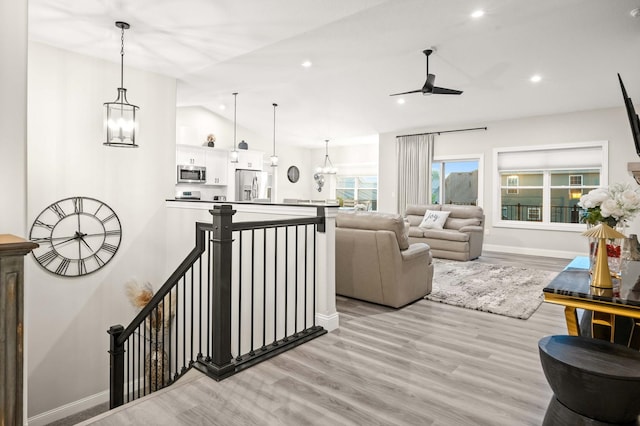 2621 Shale Rd, Normal, IL 61761 - living room featuring a chandelier, lofted ceiling, light wood-type flooring, a ceiling fan, and recessed lighting