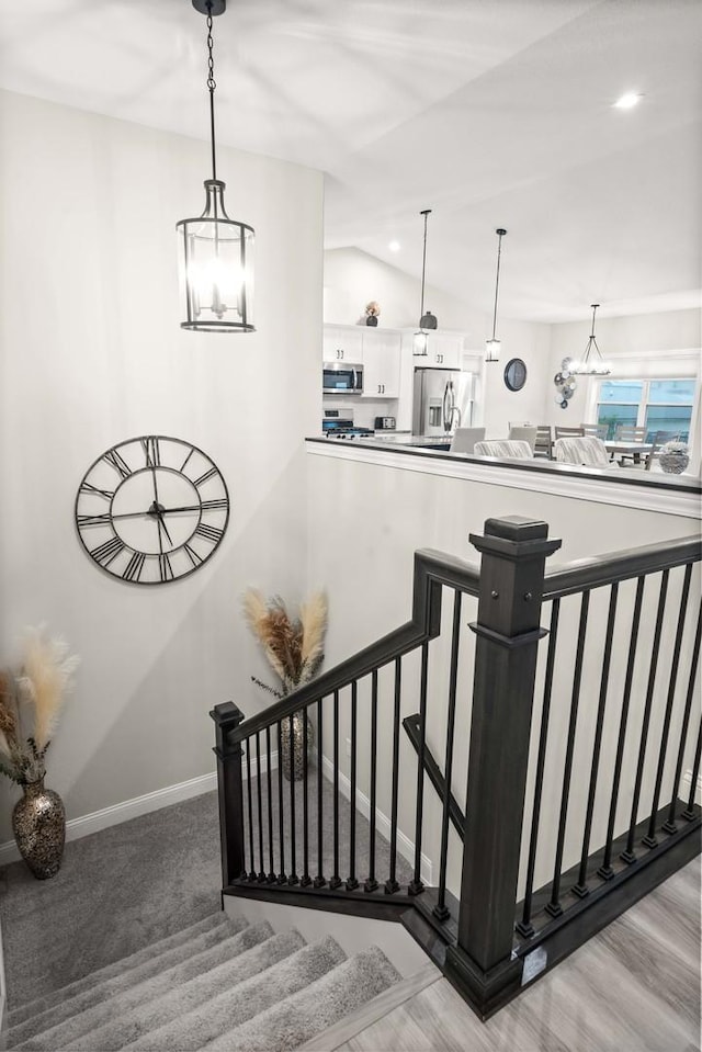 2621 Shale Rd, Normal, IL 61761 - staircase featuring a chandelier, lofted ceiling, and recessed lighting