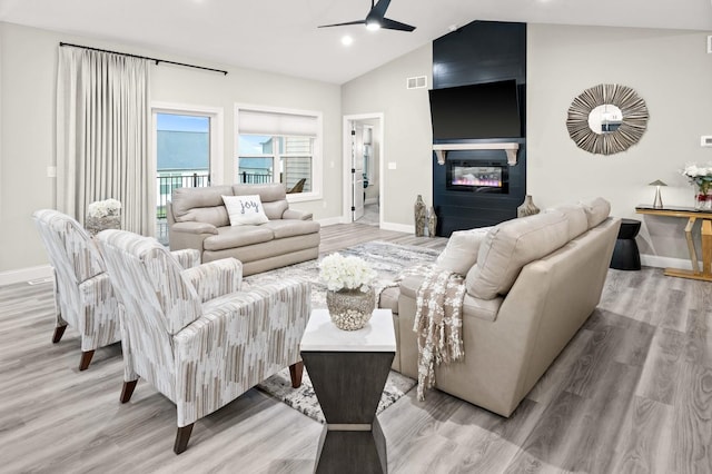 2621 Shale Rd, Normal, IL 61761 - living room with a ceiling fan, light wood-type flooring, a fireplace, vaulted ceiling, and recessed lighting