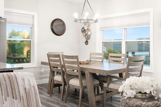 2621 Shale Rd, Normal, IL 61761 - dining space with a chandelier, wood finished floors, and healthy amount of natural light