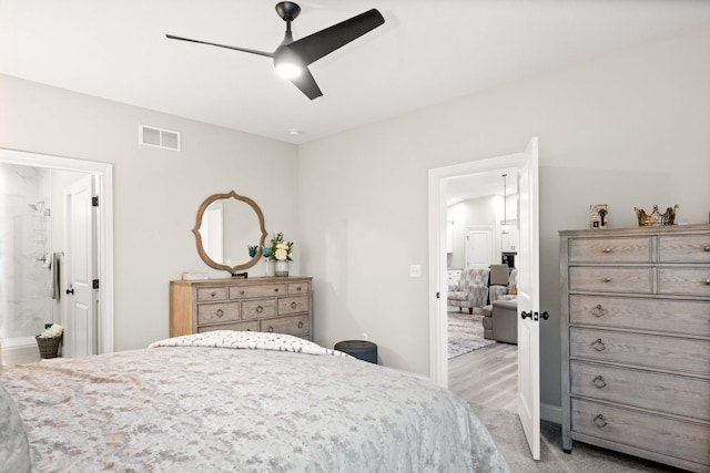 2621 Shale Rd, Normal, IL 61761 - carpeted bedroom with ceiling fan and ensuite bathroom