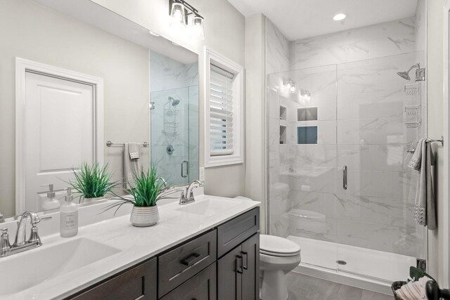 2621 Shale Rd, Normal, IL 61761 - bathroom with double vanity, a stall shower, recessed lighting, and wood finished floors