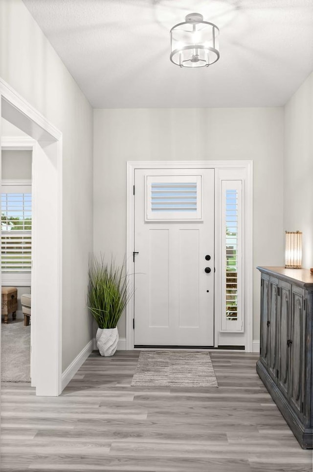 2621 Shale Rd, Normal, IL 61761 - entrance foyer featuring light wood-type flooring and a chandelier
