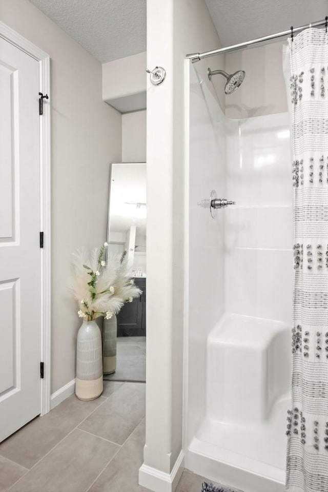 2621 Shale Rd, Normal, IL 61761 - full bath featuring a shower with shower curtain, tile patterned flooring, and a textured ceiling