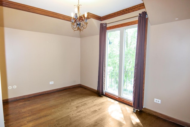 16612 S Catawba Rd, Homer Glen, IL 60491 - spare room with a chandelier, wood finished floors, and ornamental molding