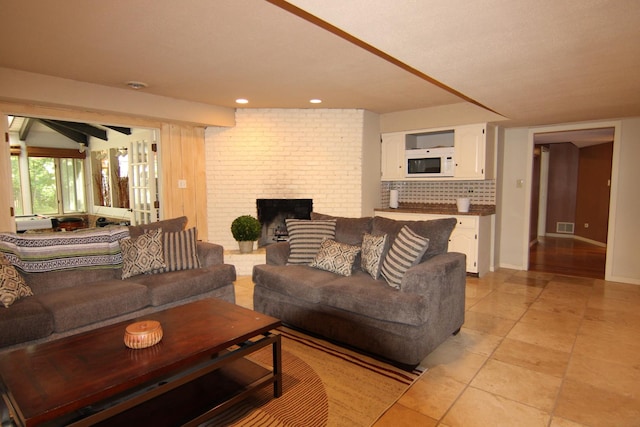 16612 S Catawba Rd, Homer Glen, IL 60491 - living area featuring a brick fireplace, light tile patterned floors, and recessed lighting