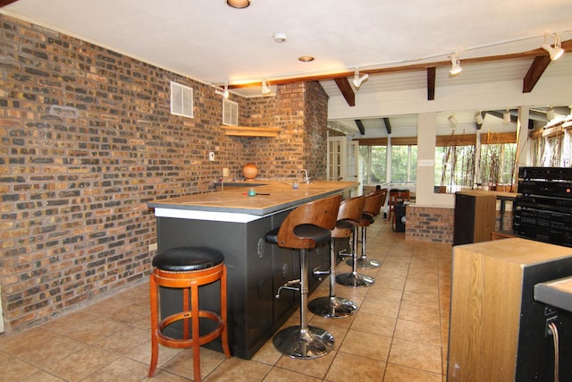 16612 S Catawba Rd, Homer Glen, IL 60491 - bar area featuring brick wall and light tile patterned floors