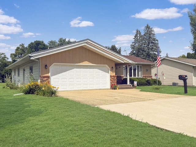610 S 2nd Ave, Forreston, IL 61030 - ranch-style home with driveway, an attached garage, a front yard, and brick siding
