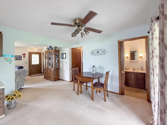 610 S 2nd Ave, Forreston, IL 61030 - dining room featuring a ceiling fan, light colored carpet, and a textured ceiling
