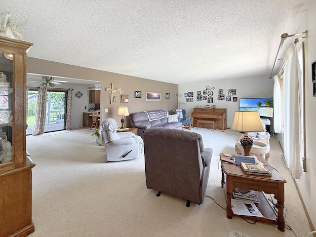 610 S 2nd Ave, Forreston, IL 61030 - living area with light colored carpet, a textured ceiling, and ceiling fan