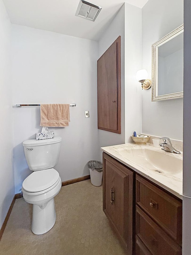 610 S 2nd Ave, Forreston, IL 61030 - half bathroom featuring toilet and vanity