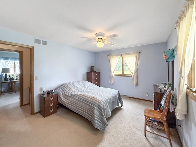 610 S 2nd Ave, Forreston, IL 61030 - bedroom with light colored carpet and ceiling fan