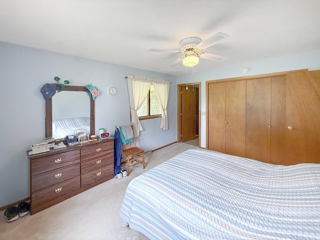 610 S 2nd Ave, Forreston, IL 61030 - bedroom featuring light colored carpet, a closet, and a ceiling fan