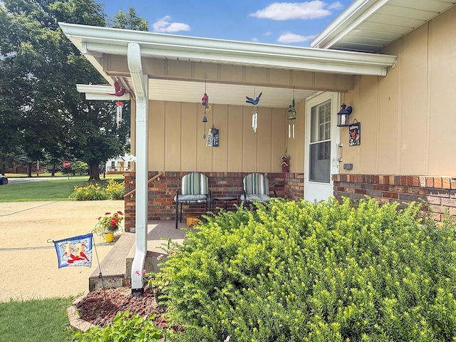 610 S 2nd Ave, Forreston, IL 61030 - property entrance featuring board and batten siding and a porch