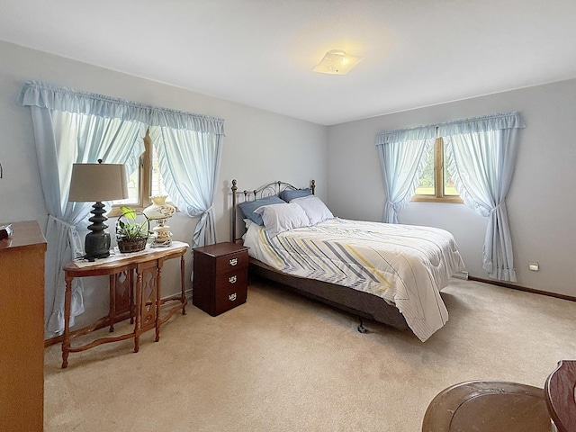 610 S 2nd Ave, Forreston, IL 61030 - bedroom featuring light colored carpet and baseboards