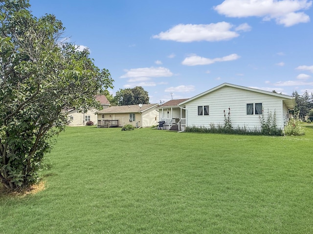 610 S 2nd Ave, Forreston, IL 61030 - back of house featuring a yard
