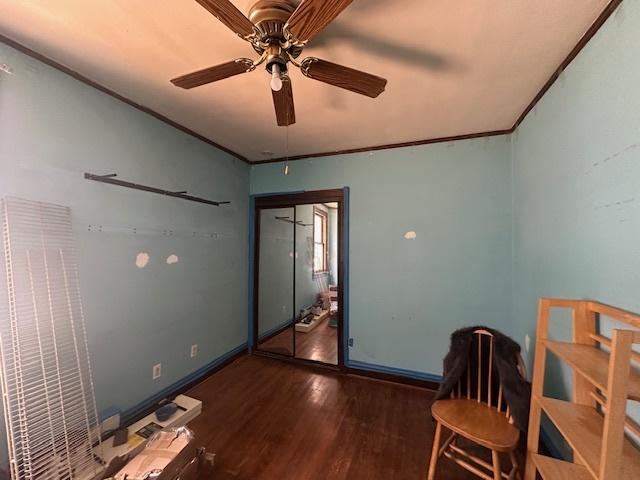 4540 N Menard Ave, Chicago, IL 60630 - bedroom with wood finished floors, ornamental molding, and a ceiling fan