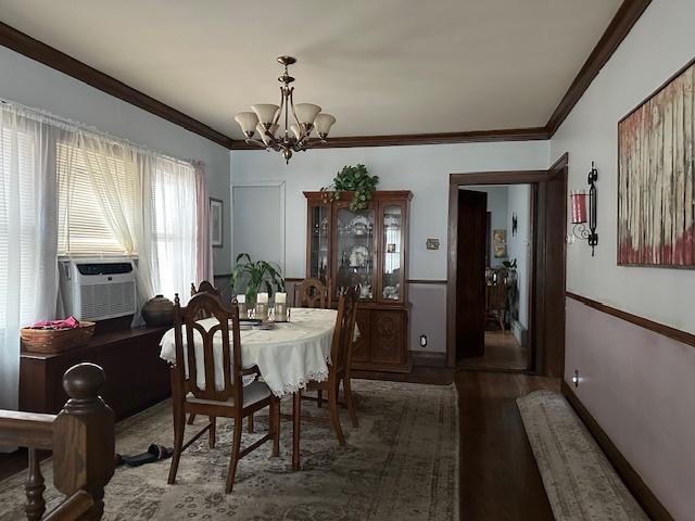 4540 N Menard Ave, Chicago, IL 60630 - dining space with a chandelier, ornamental molding, wood finished floors, and cooling unit
