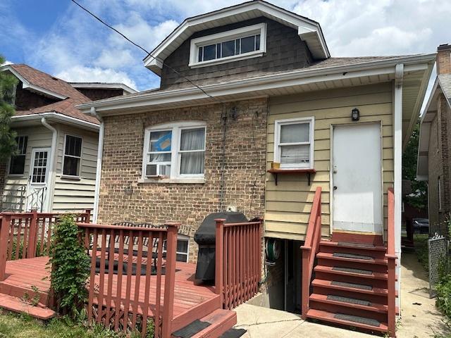 4540 N Menard Ave, Chicago, IL 60630 - rear view of property with entry steps, a wooden deck, brick siding, and cooling unit