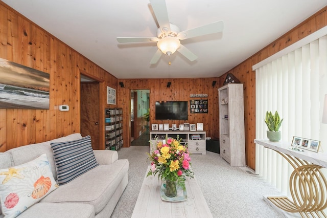 26477 Springwell St, Antioch, IL 60002 - living area with wooden walls, a ceiling fan, and light carpet