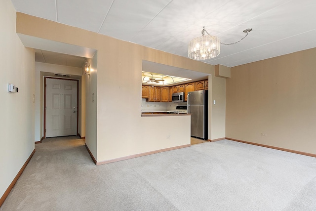 11020 S Keating Ave Unit 202, Oak Lawn, IL 60453 - unfurnished living room featuring light colored carpet and a chandelier