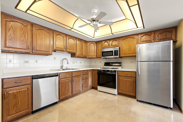 11020 S Keating Ave Unit 202, Oak Lawn, IL 60453 - kitchen featuring appliances with stainless steel finishes, brown cabinetry, a raised ceiling, and ceiling fan