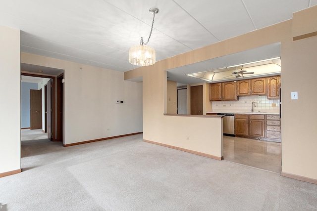11020 S Keating Ave Unit 202, Oak Lawn, IL 60453 - kitchen with stainless steel dishwasher, brown cabinets, light colored carpet, and a chandelier