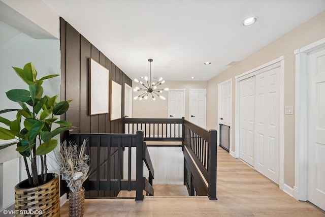 9N909 Koshare Trl, Elgin, IL 60124 - hallway featuring an upstairs landing, light wood-style flooring, a chandelier, and recessed lighting