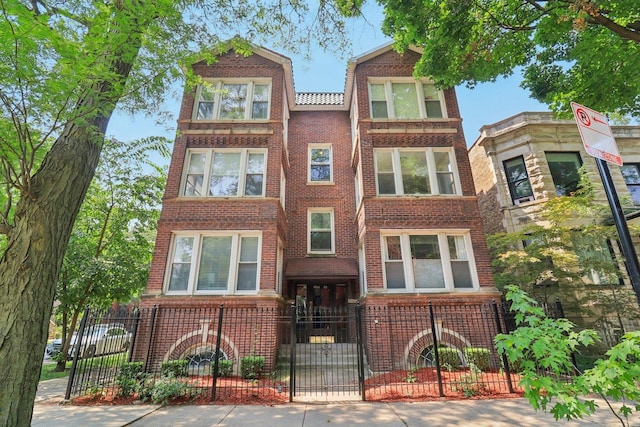 4702 N Campbell Ave Unit 2, Chicago, IL 60625 - view of front of property with brick siding and a gate