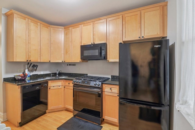 4702 N Campbell Ave Unit 2, Chicago, IL 60625 - kitchen featuring black appliances, light wood-style floors, light brown cabinetry, and dark stone counters
